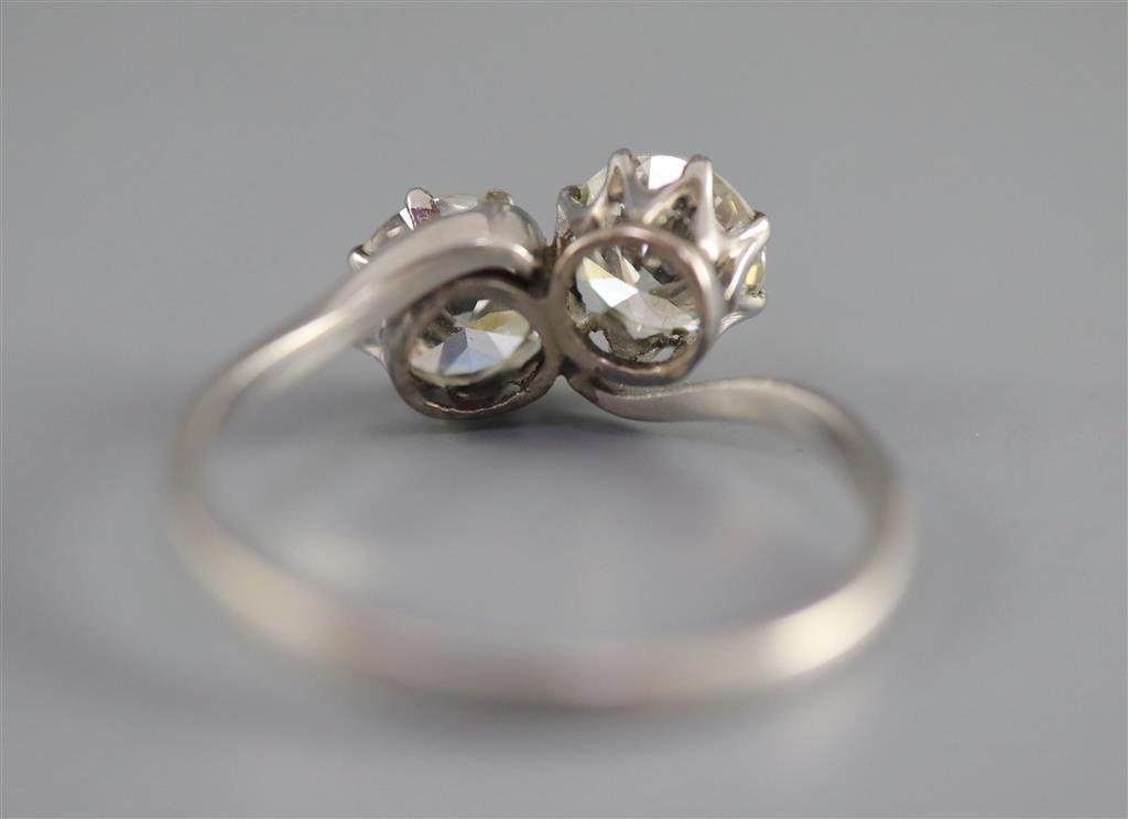 A platinum? and two stone diamond crossover ring,